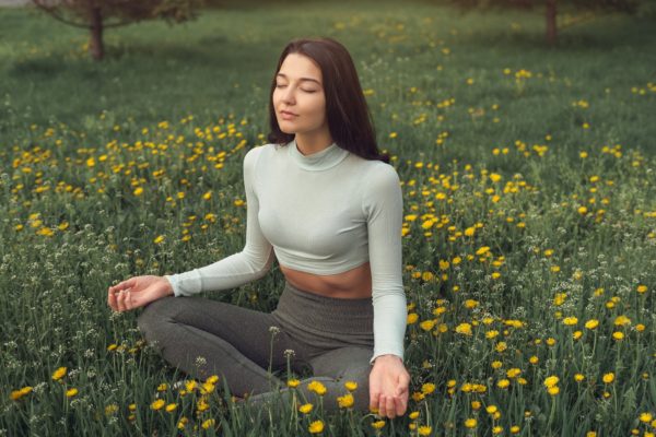 woman-meditating-on-the-meadow-outdoors.jpg